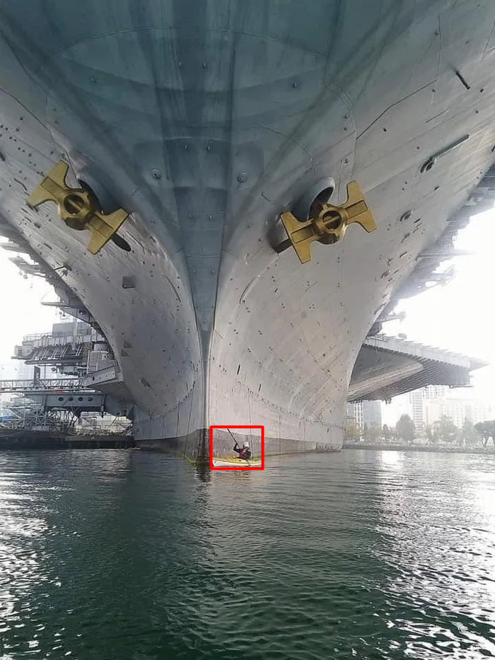 Kayak with the aircraft carrier.