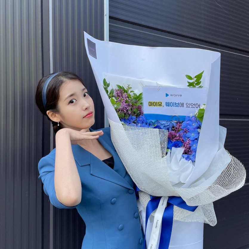 IU got a bouquet the size of her body.