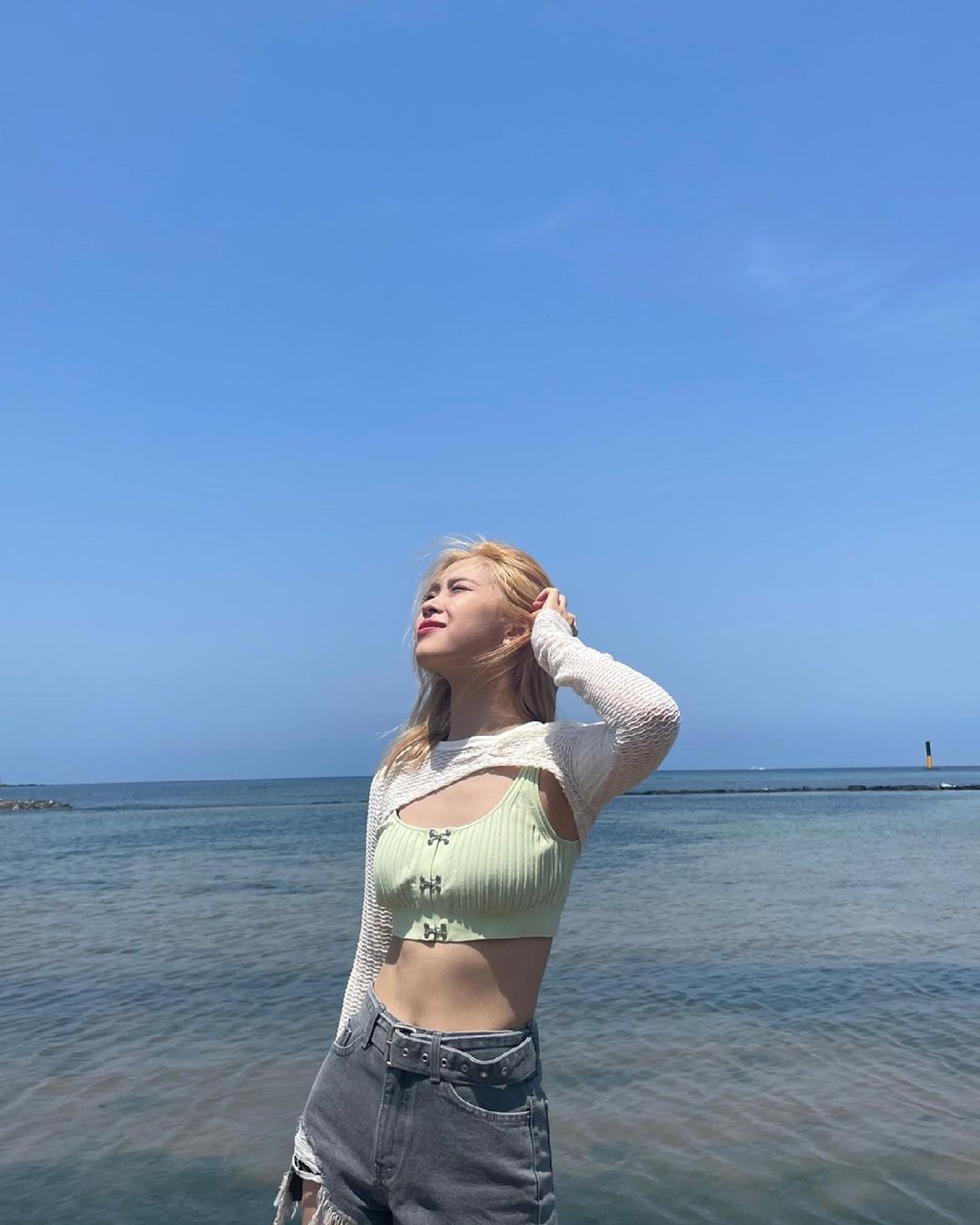 ITZY went to the beach in Jeju Island.