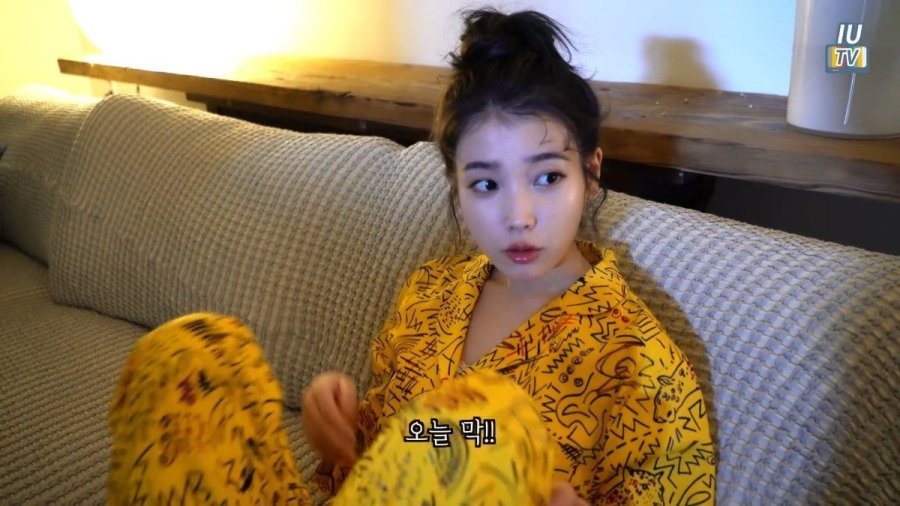 Yellow pajamas with bun hair IU.