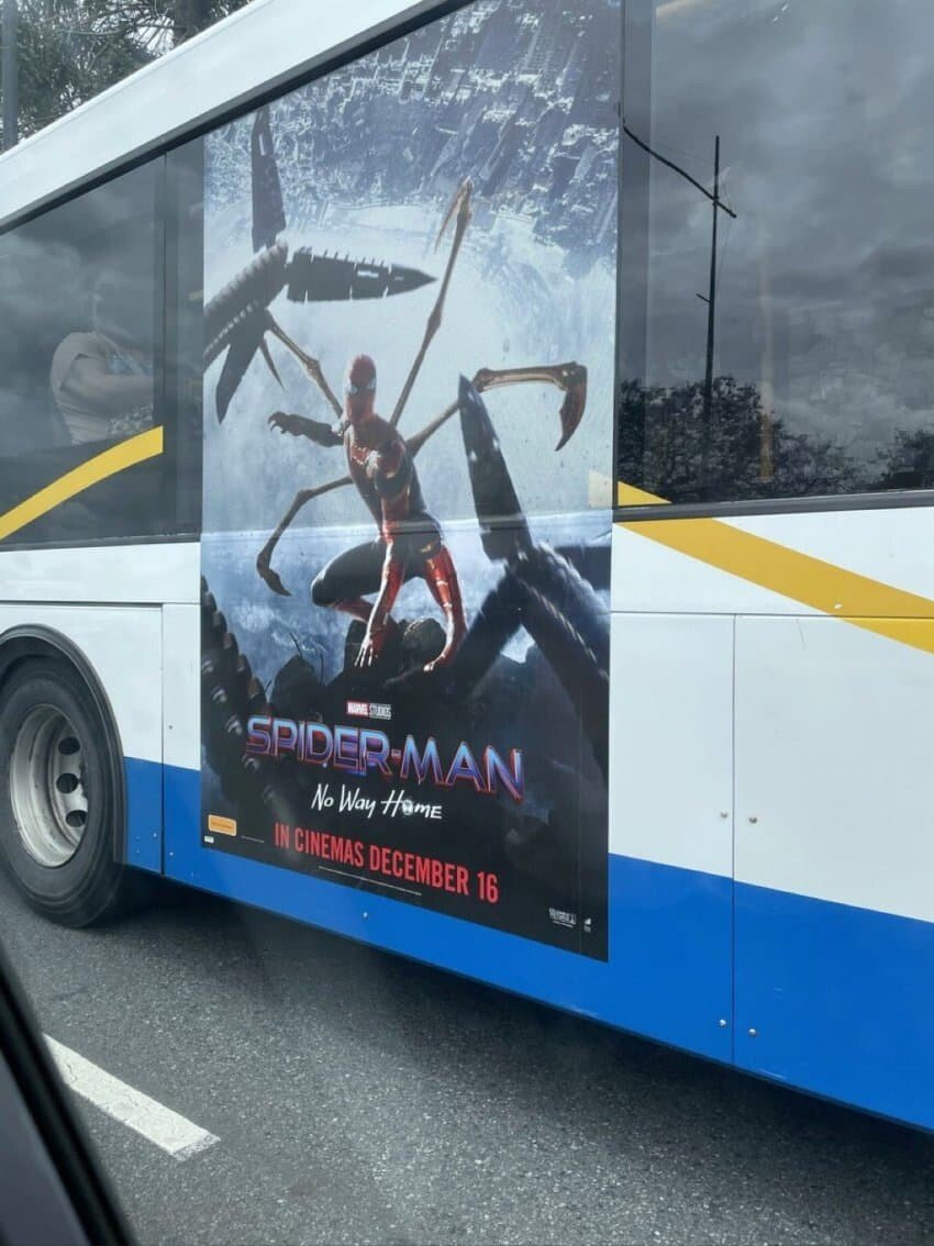 Let's promote Spider-Man. Posters are on the bus.