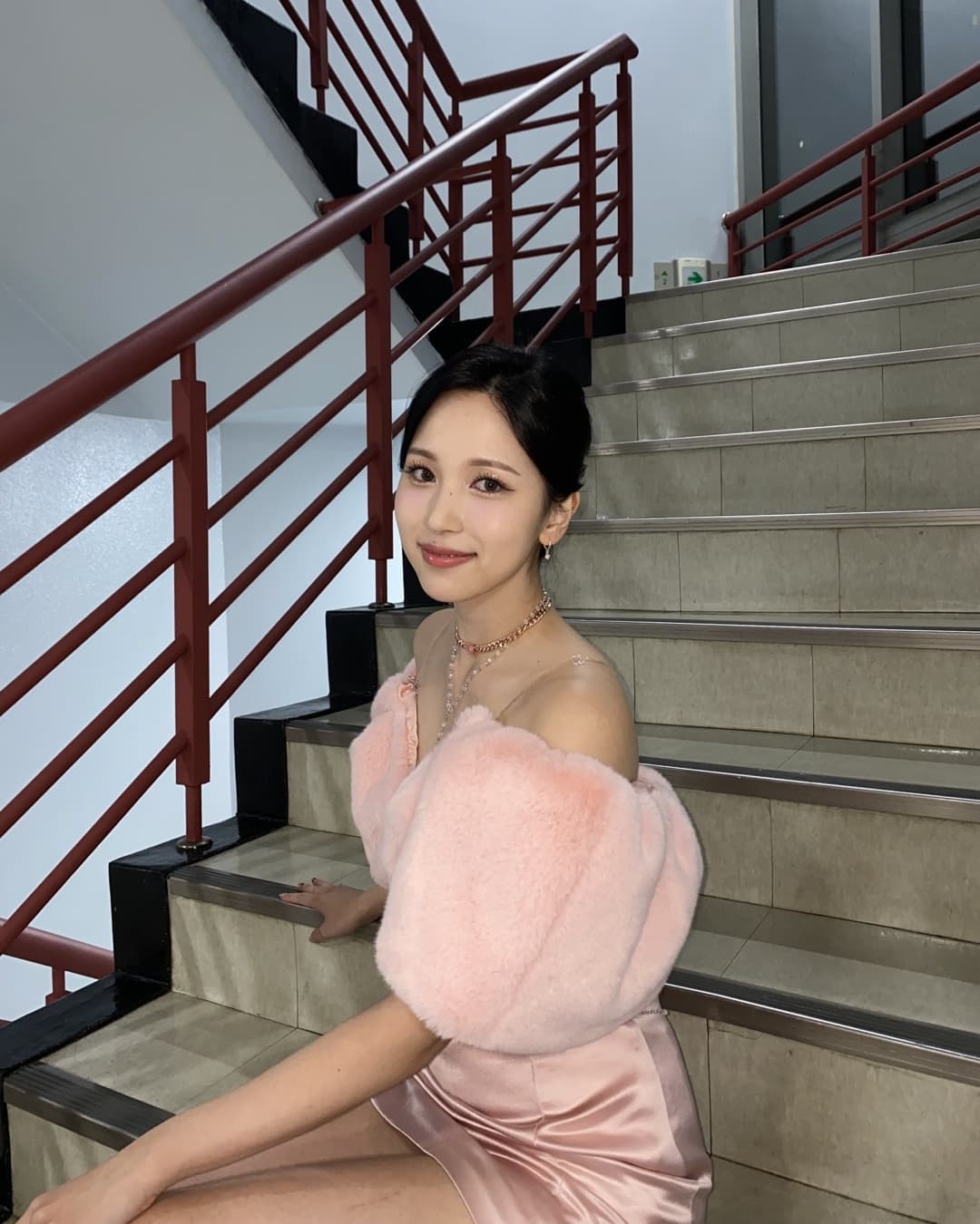 MINA on the stairs.