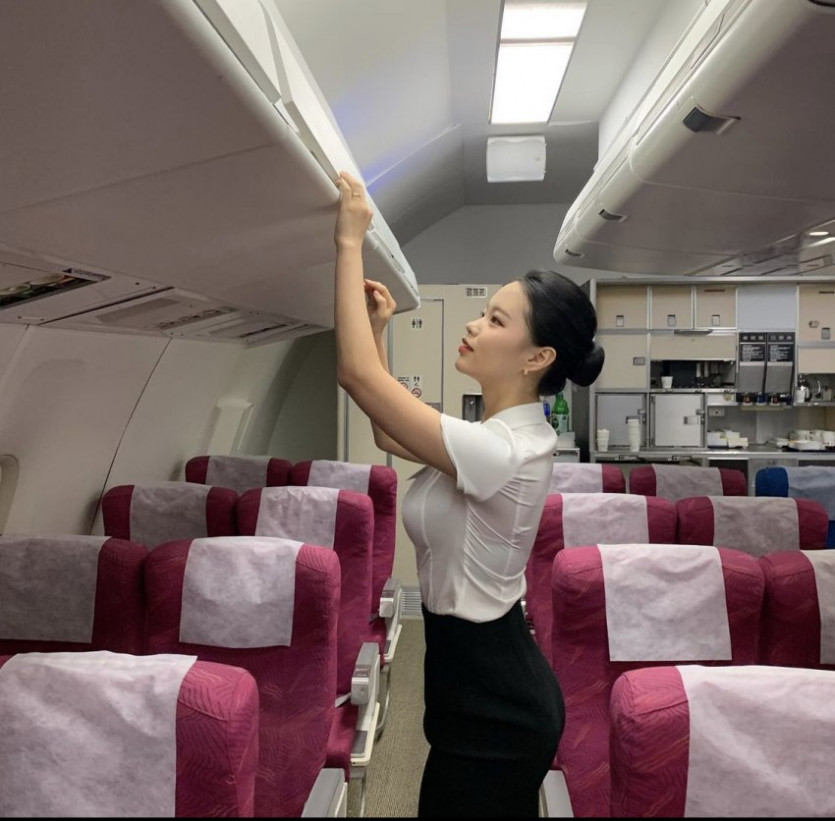 The side profile of a flight attendant.