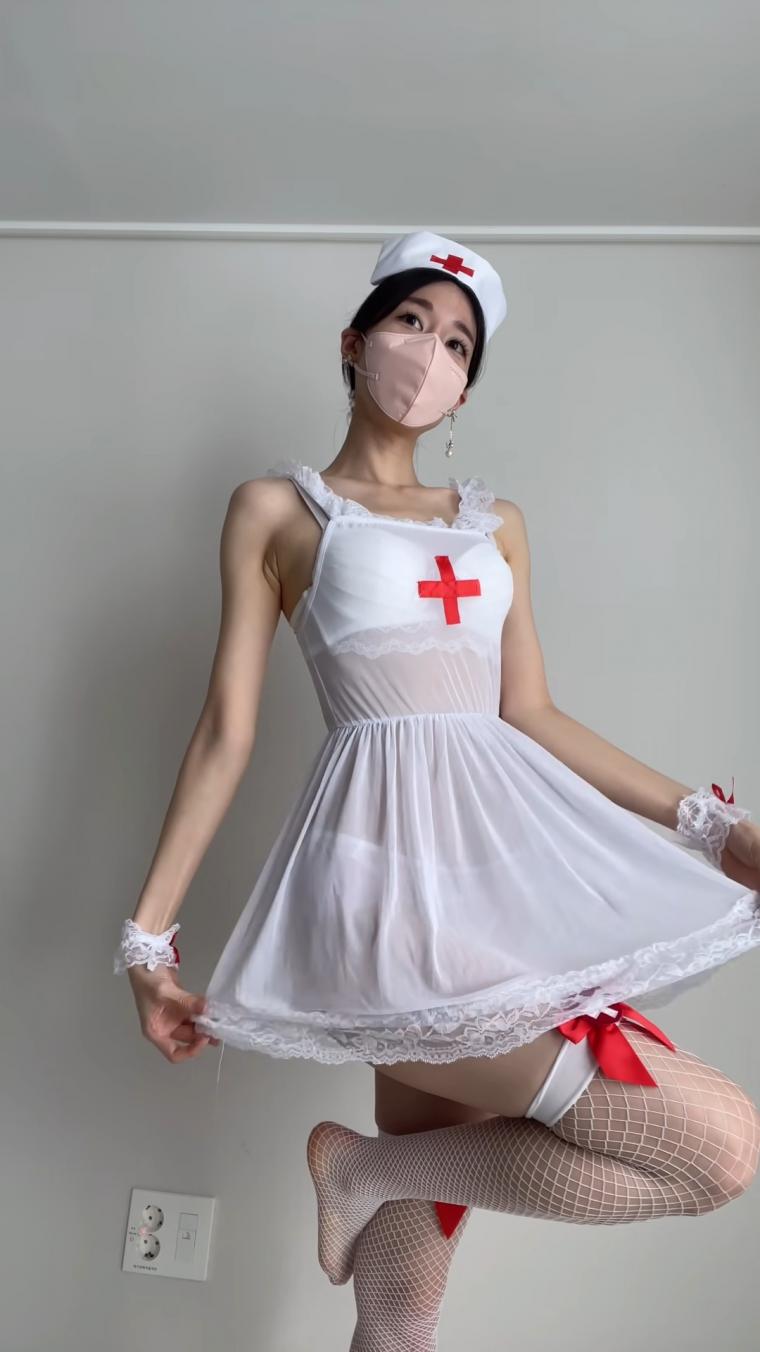 YouTuber Evelyn. Nurse cosplay. Garter belt stockings shoot