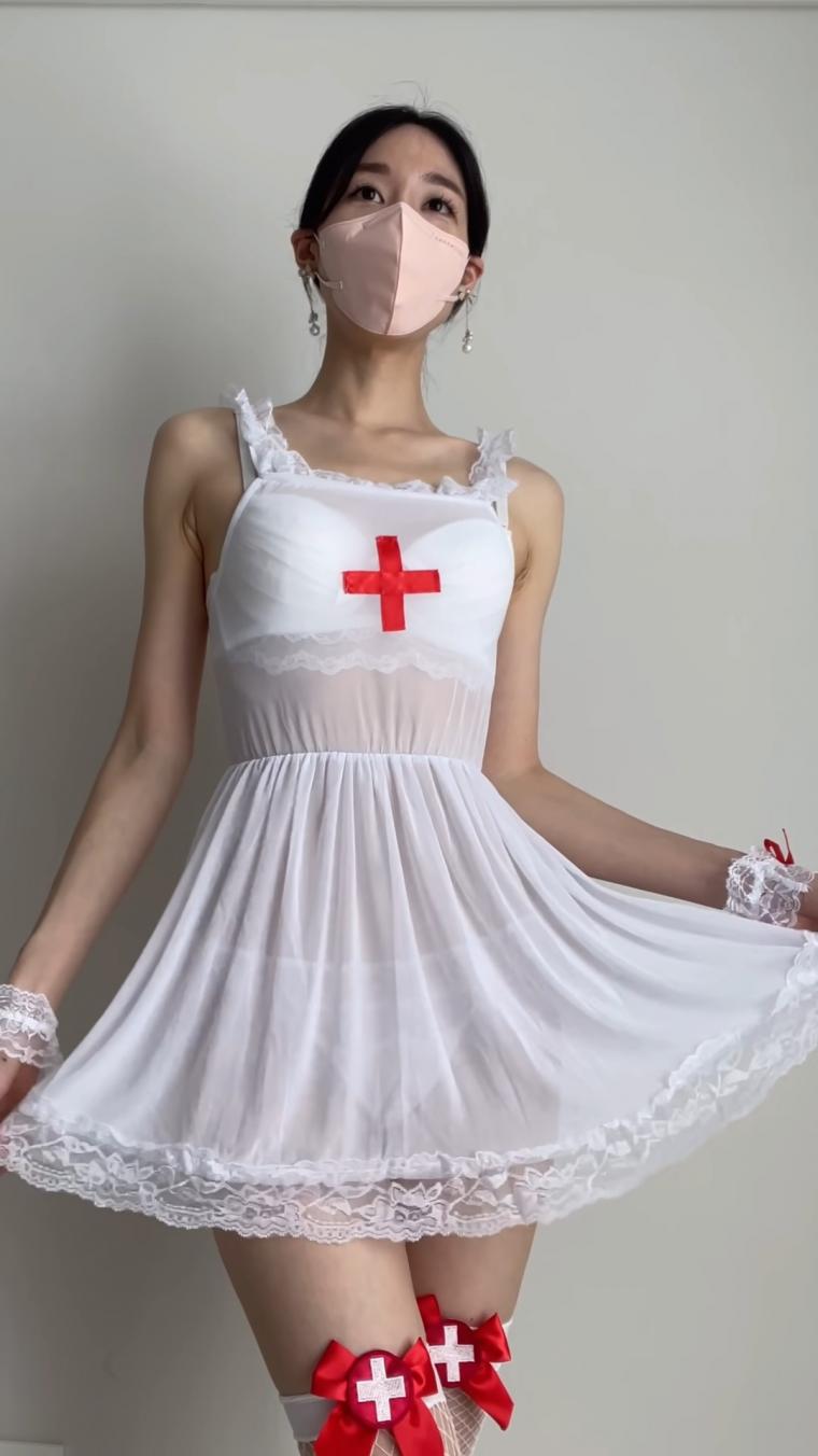 YouTuber Evelyn. Nurse cosplay. Garter belt stockings shoot