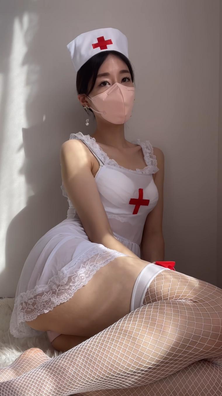 YouTuber Evelyn. Nurse cosplay. Garter belt stockings shoot